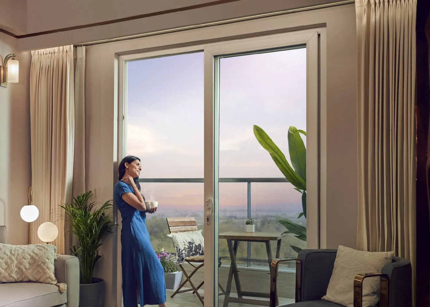 Living room with sliding doors to the balcony - Artistic Impression